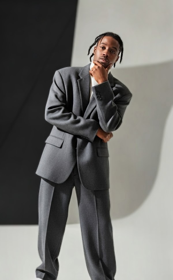 Reko Denim in an oversized grey suit