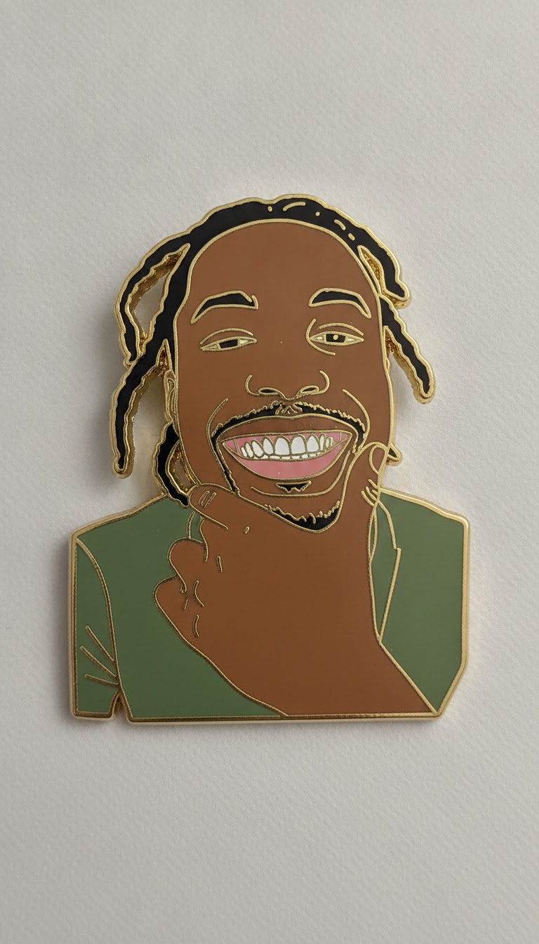 Gold enamel pin of Reko Denim smiling